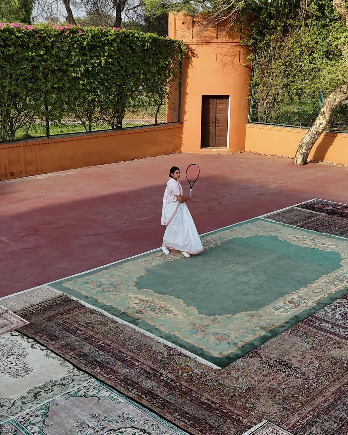 Luxury rugs displayed in lifestyle setting — the premium positioning that commands A&D attention